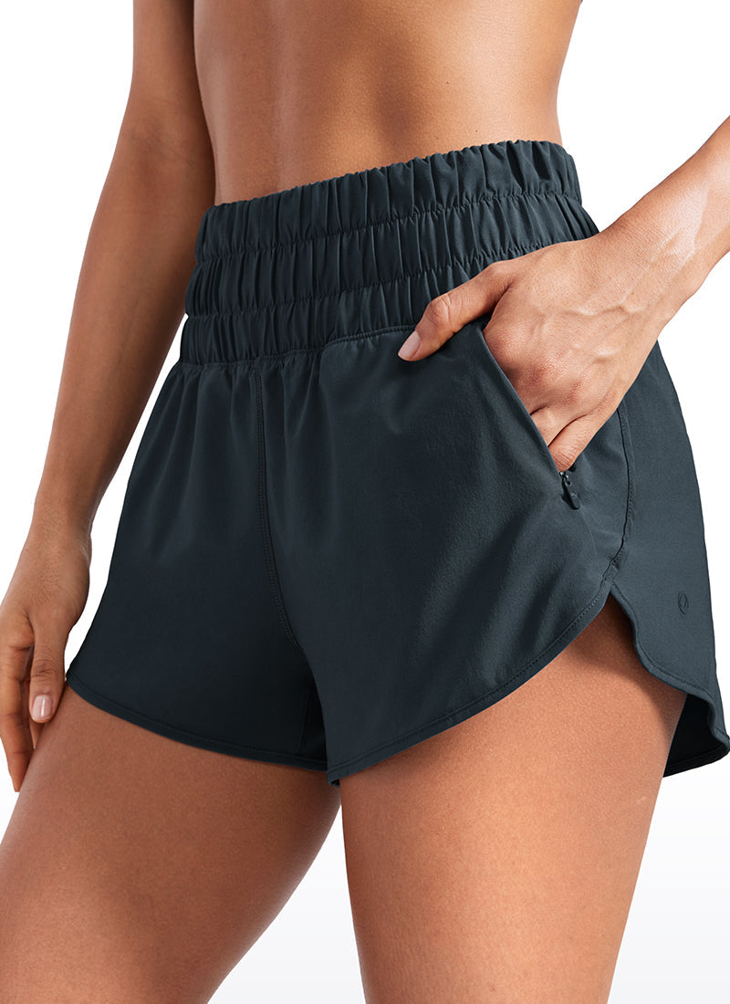 Feathery-Fit Soft High Waisted Dolphin Running Shorts With Zipper Pocket 3''